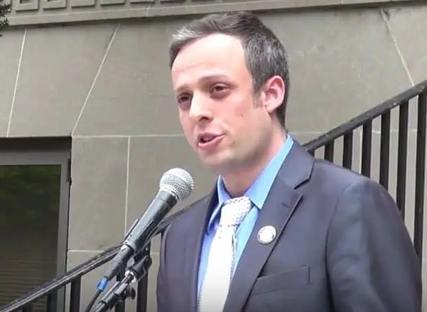 Man speaking at a microphone