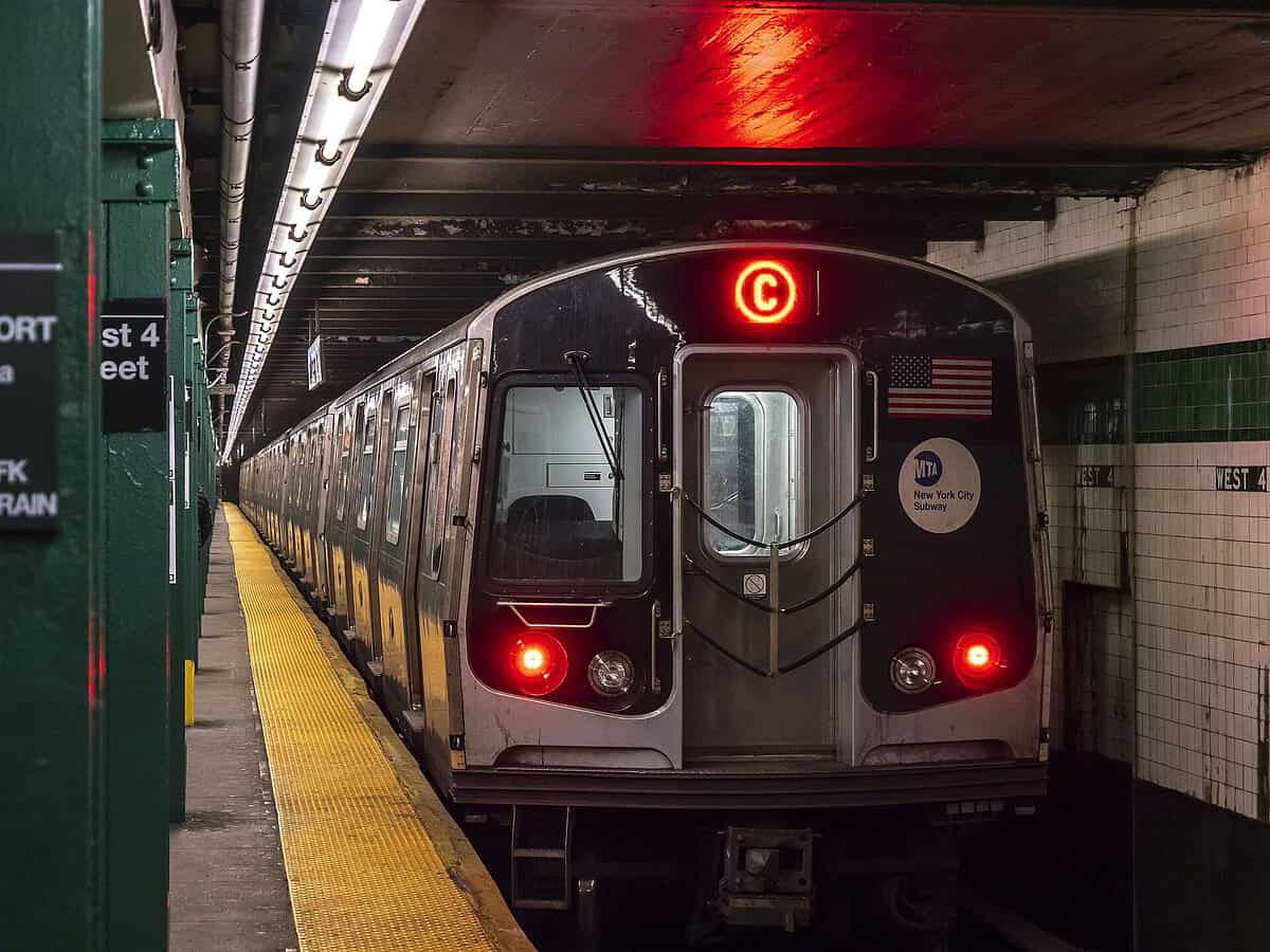 A northbound R179 C train pulling out of West 4th Street in Manhattan, IND Eighth Avenue Line.