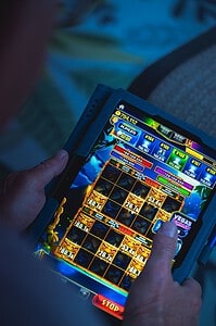 mobile video game on tablet in hands