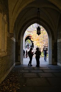 historic arched passageway with fall foliage